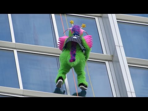 Orlando Magic mascot Stuff rappels down Hyatt Regency on International Drive
