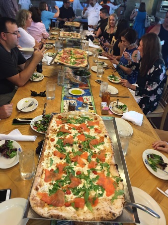 Via Napoli's pizzas on a table