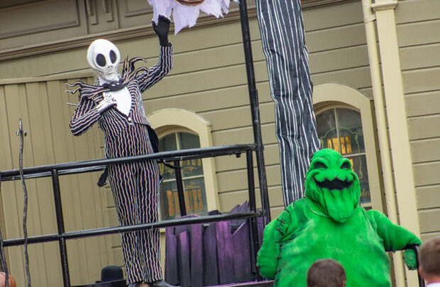 Jack and Oogie Boogie wave goodbye to guests as they head back.