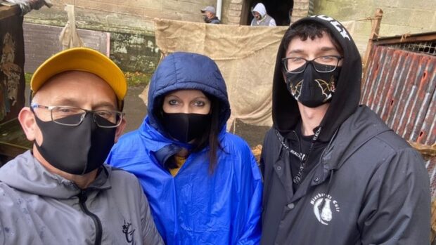 The Kennedy family wearing their face coverings at a rainy Alton Towers.