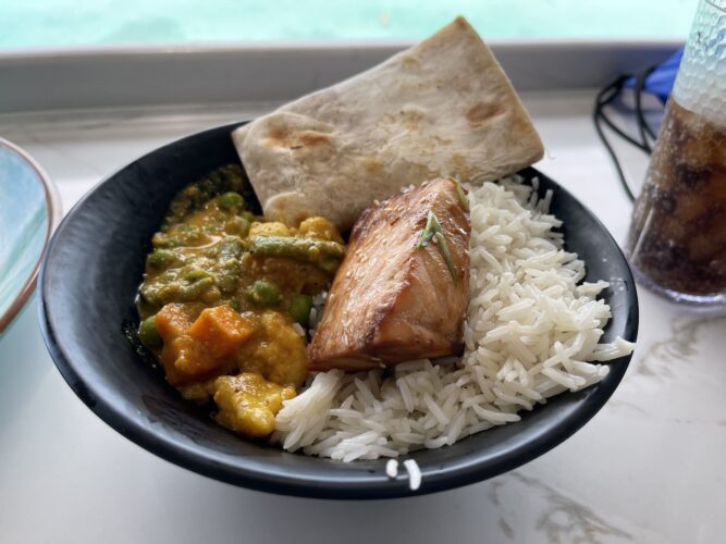 A curry bowl with added salmon from the Marceline Market on the Disney Wish.
