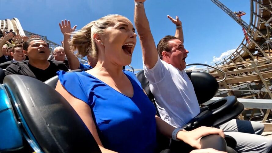 Village Roadshow CEO Clark Kirby and a friend scream while riding Leviathan.