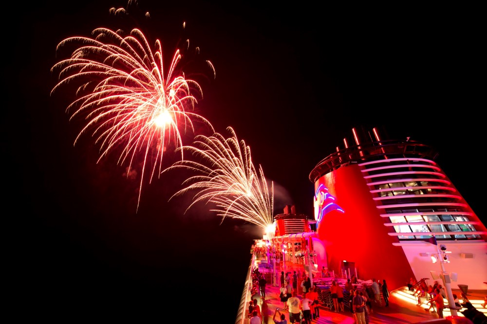 Fireworks display above a Disney Cruise Line ship