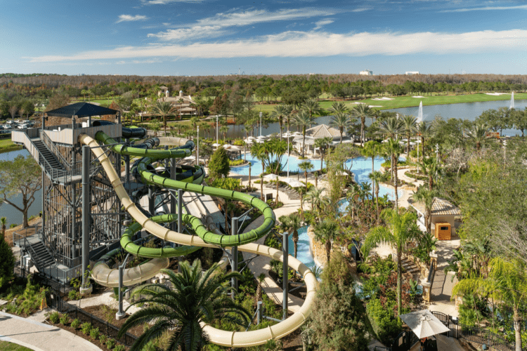 Slides, pools, and palm trees at Grande Lakes Orlando water park