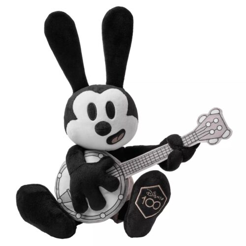 Black-and-white plush doll of Oswald the Lucky Rabbit playing the banjo
