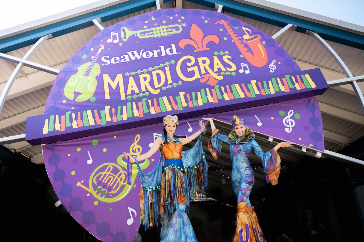 Two stilt walkers at SeaWorld Orlando Mardi Gras