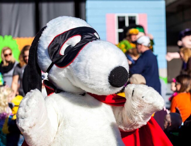 Snoopy dressed like a superhero, with cape and mask