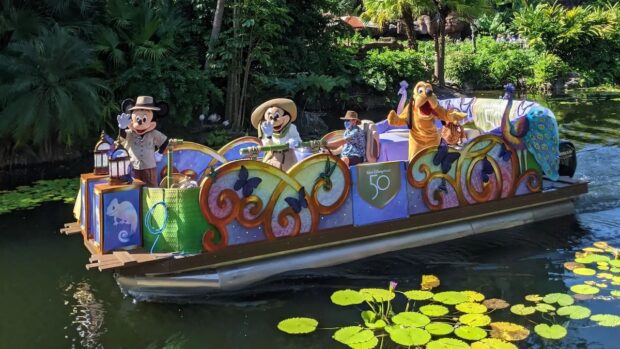 Mickey, Minnie, and Pluto on a flotilla at Disney's Animal Kingdom
