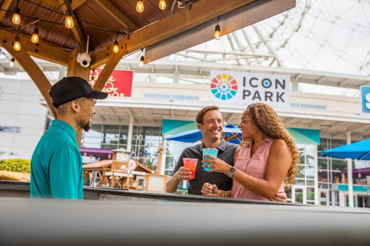Icon Park Sip n' Savor couple at an outdoor bar