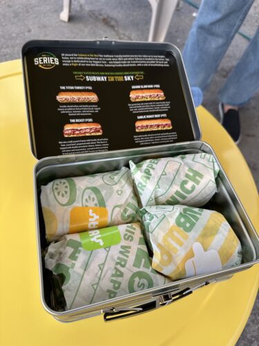 A lunchbox full of Subway subs.