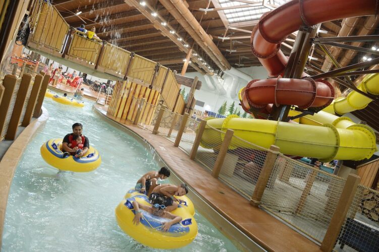 families in the lazy river of a Great Wolf Lodge location