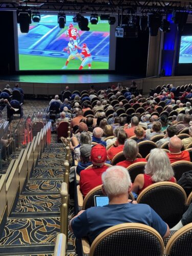 Fans watching the Super Bowl in the Sky Princess Theater.