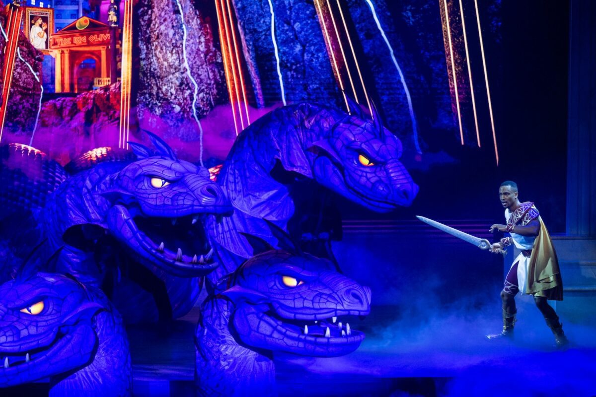 Hercules faces the multiheaded hydra in the theatrical show Hercules on the Disney Destiny