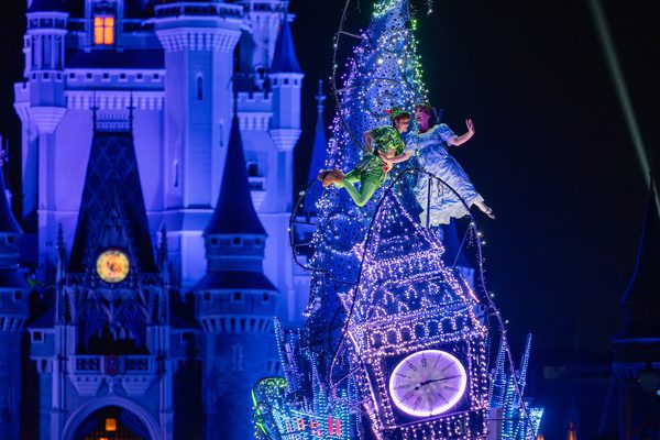 peter pan and wendy soar at disney nighttime parade