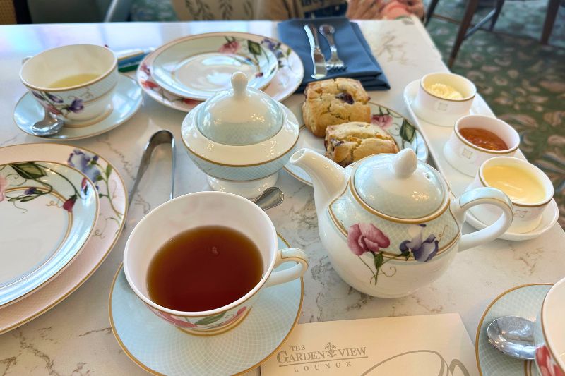 Grand Floridian afternoon tea orange cranberry scones with accompaniments and tea cups Photo by Dani Meyering
