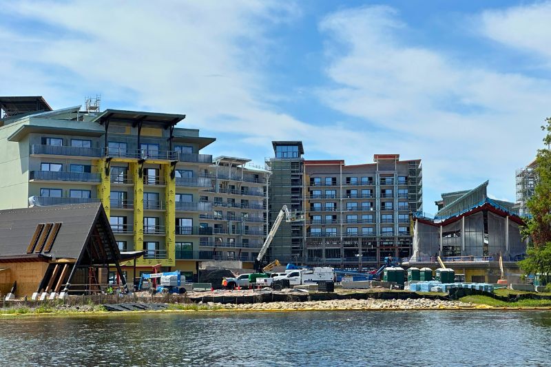 Lakeshore Lodge lobby and east tower with a-frame cabin during construction April 2026