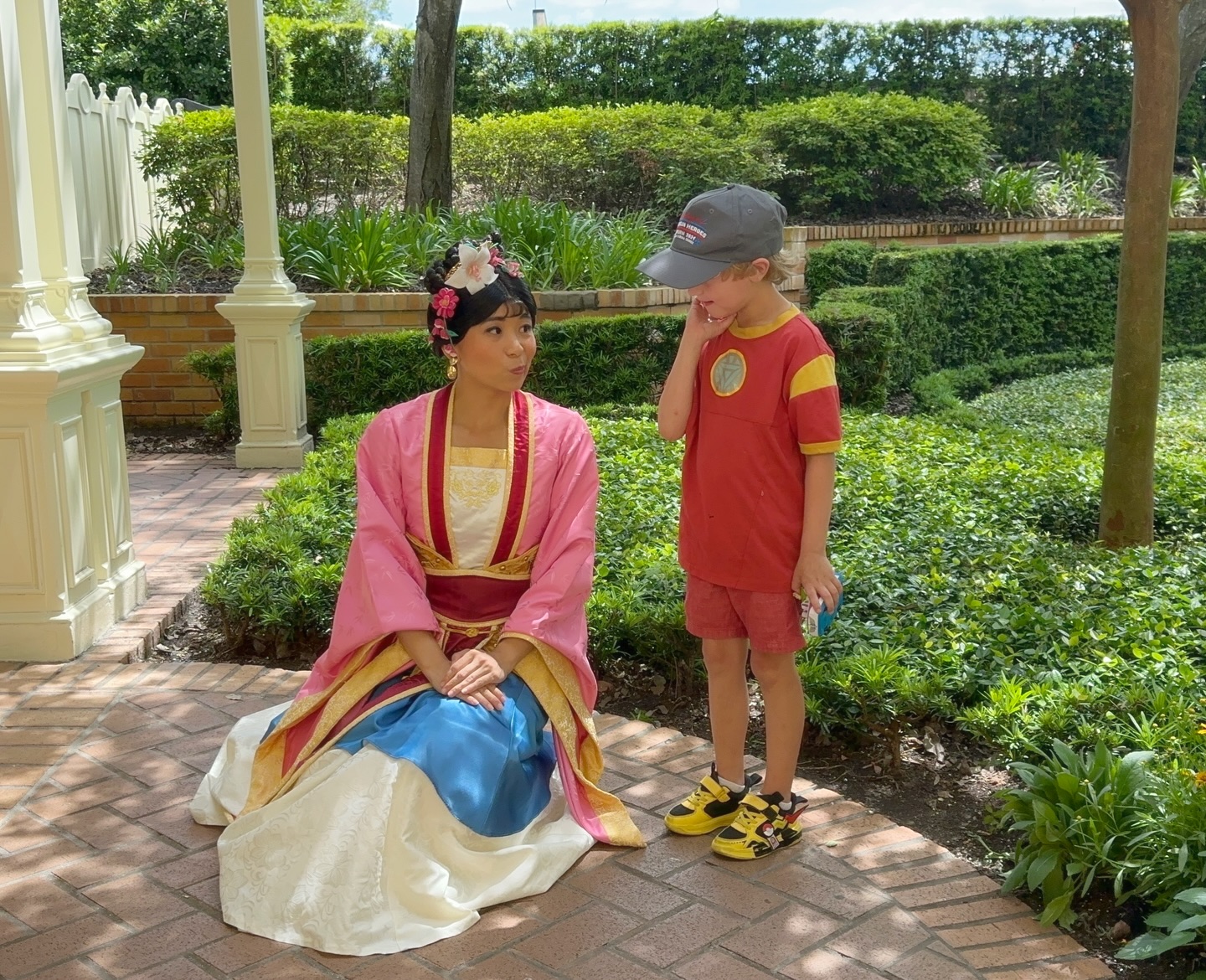 Mulan greets boy at Magic Kingdom
