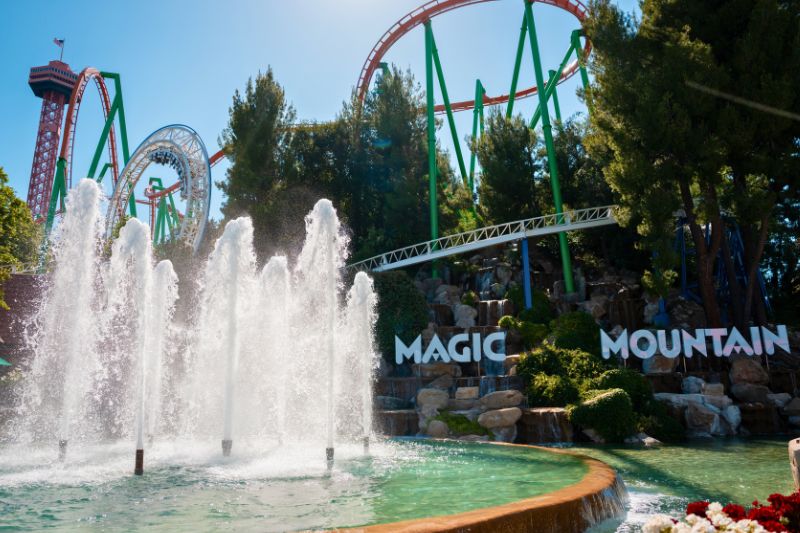 Six Flags Magic Mountain sign with Great American Revolution loop in background - Courtesy of Six Flags