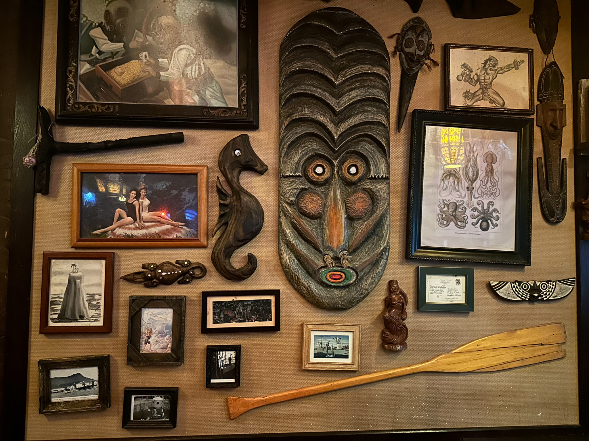 Trader Sam's Grog Grotto Mai-Kai postcard on the wall and other decorations and art