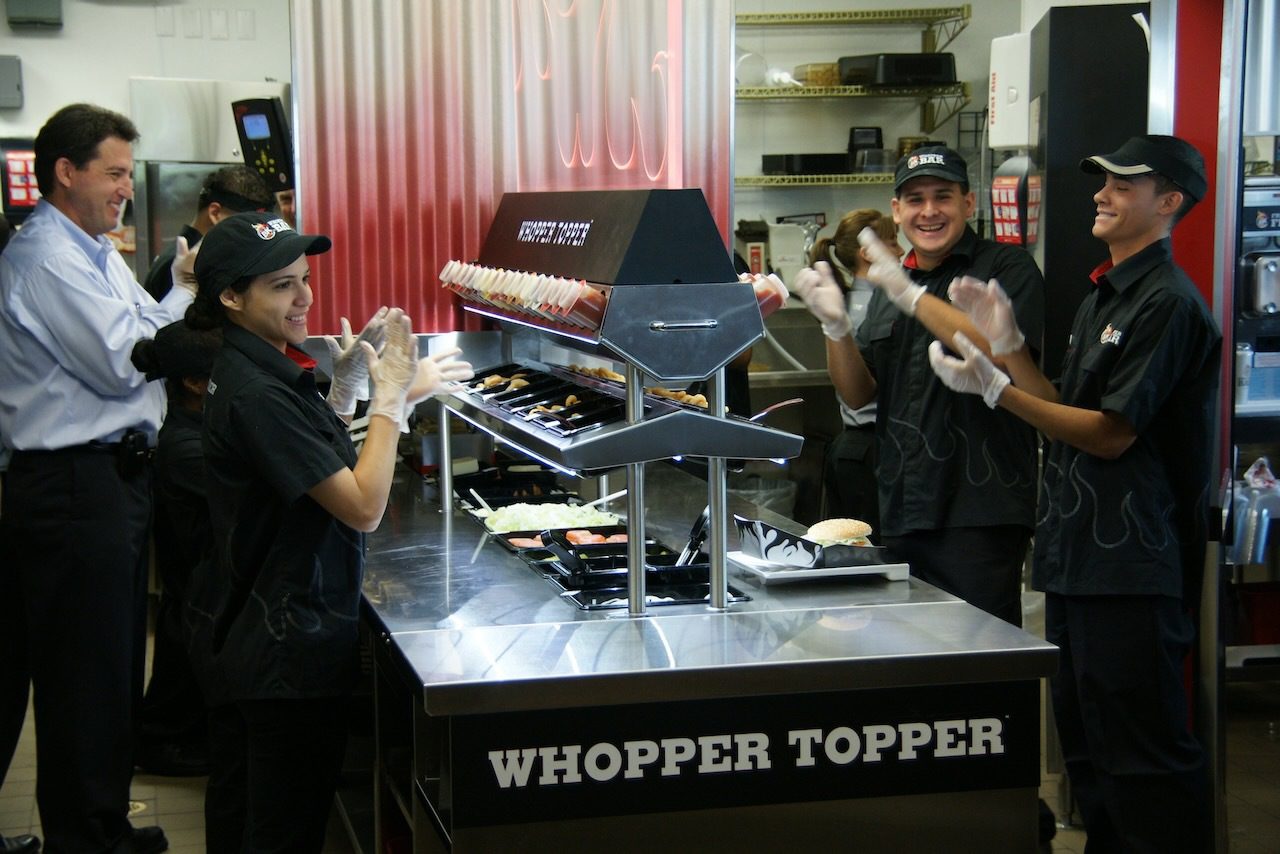 Whopper Bar at Universal Orlando CityWalk opening in 2009. crew members on the whopper topper line
