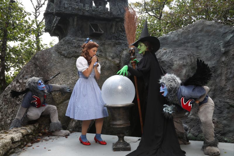 Wizard of Oz theme park North Carolina Land of Oz Dorothy performer with Wicked Witch and monkey performers - Courtesy of Land of Oz