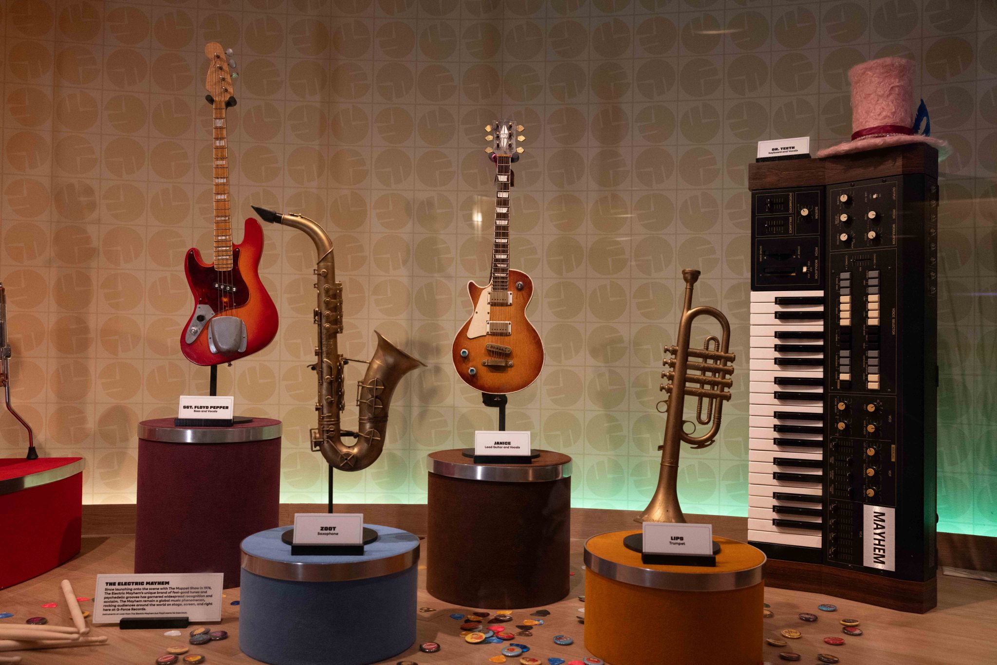 guitars and horns rom the electric mayhem muppets in a display case