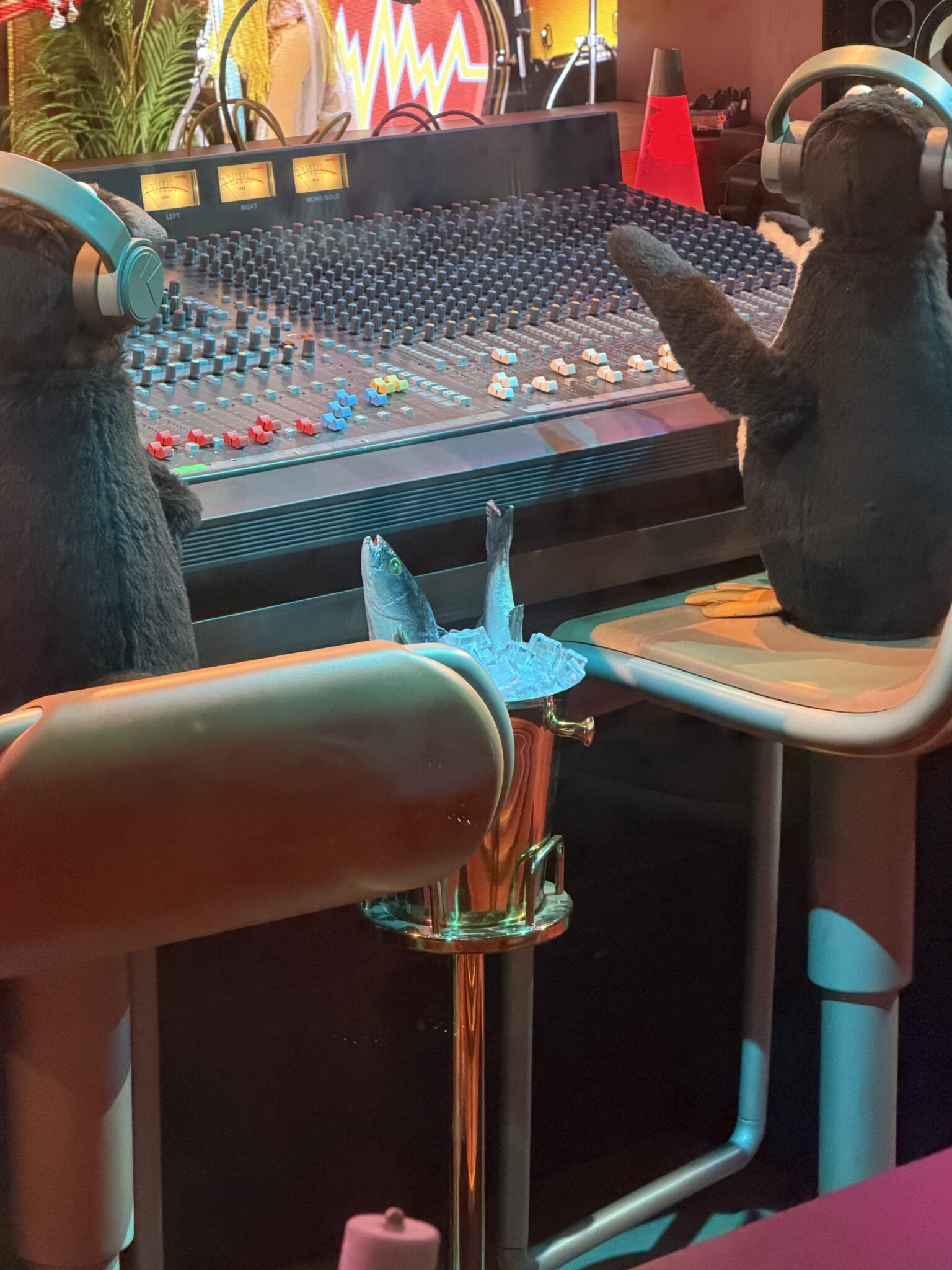 bucket of fish on ice muppets prop between two penguin animatronics