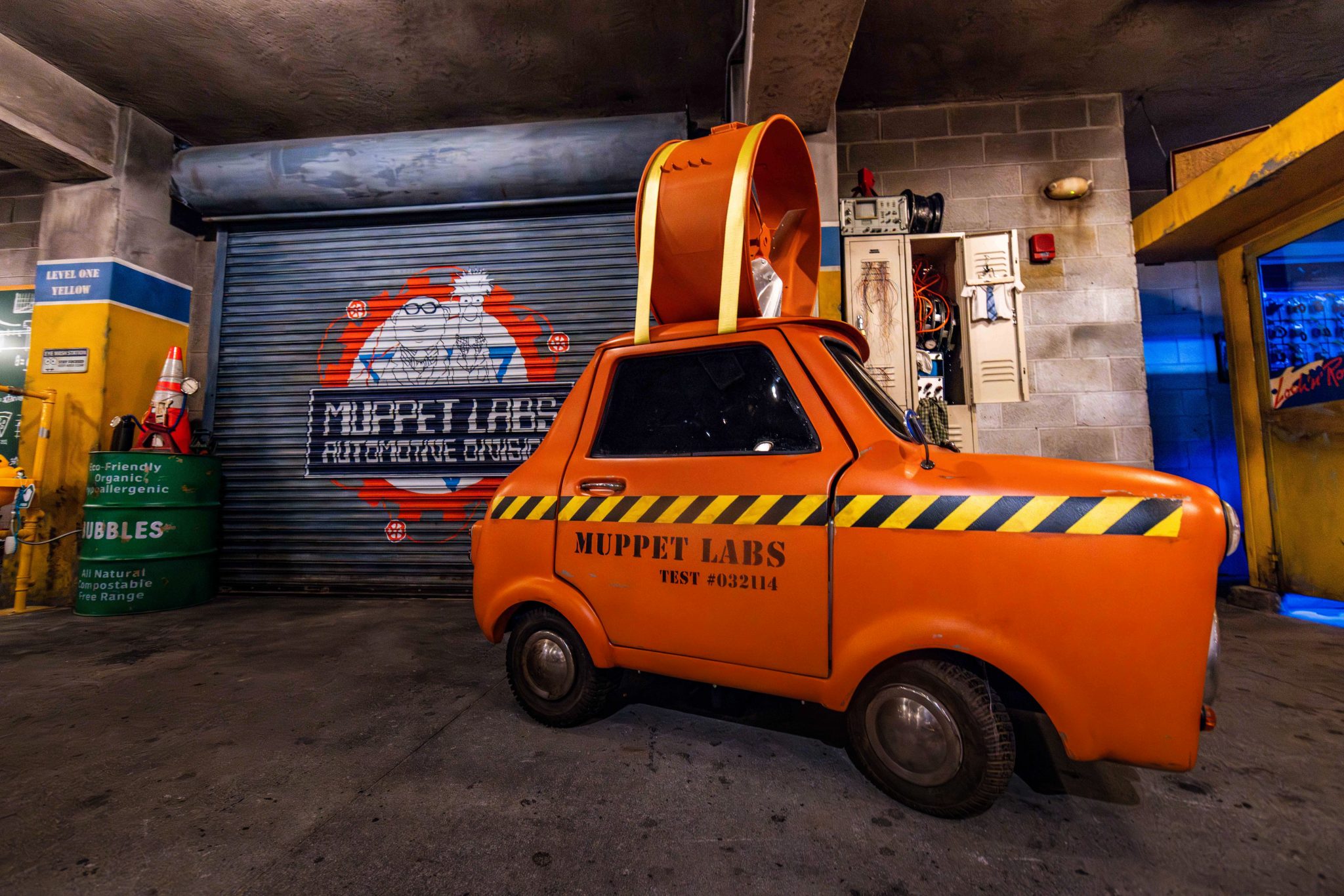 Small interpol car from the muppets most wanted movie on a garage style platform