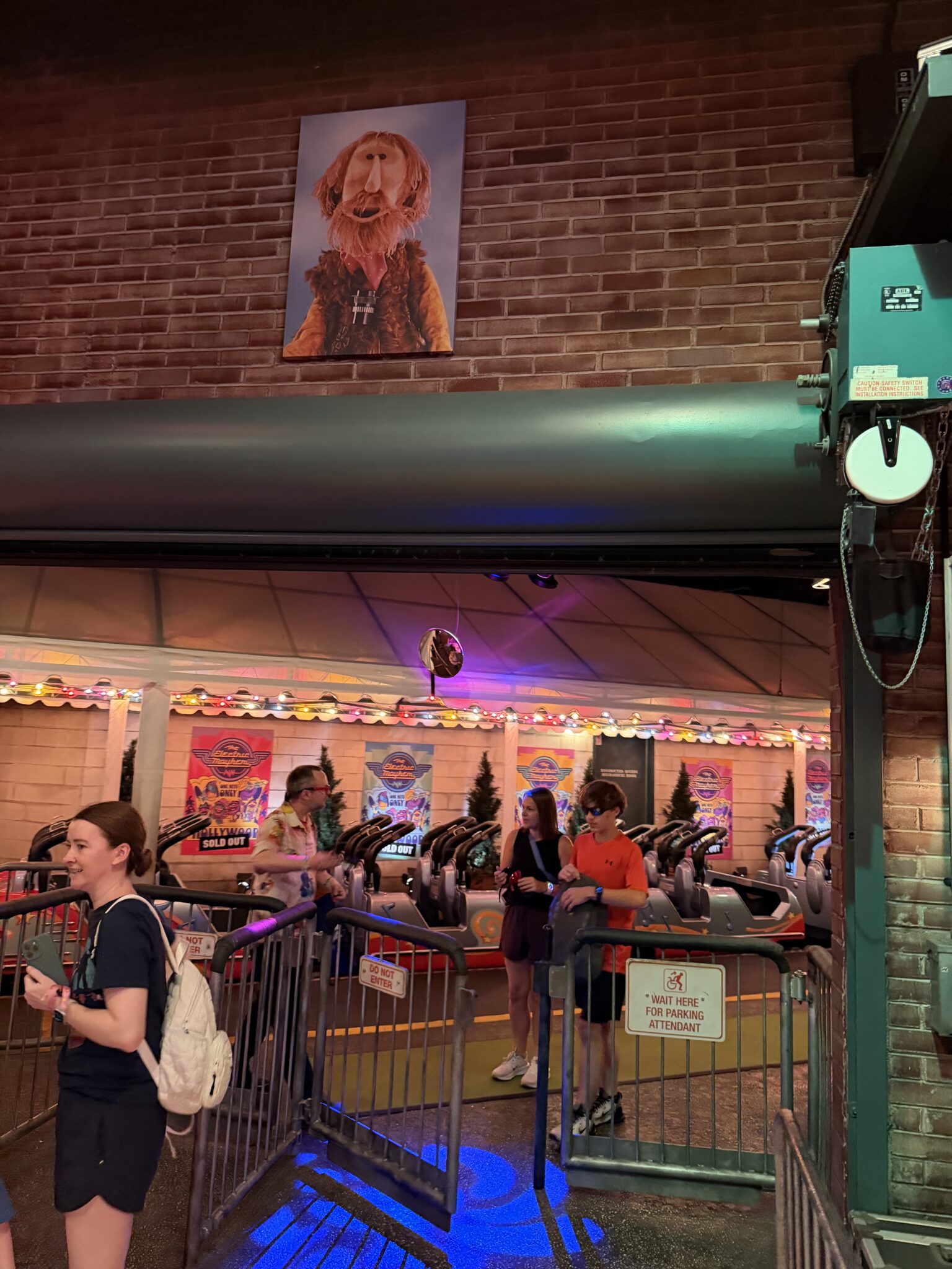 Jim Henson as a muppet portrait hanging above the ride vehicle exit