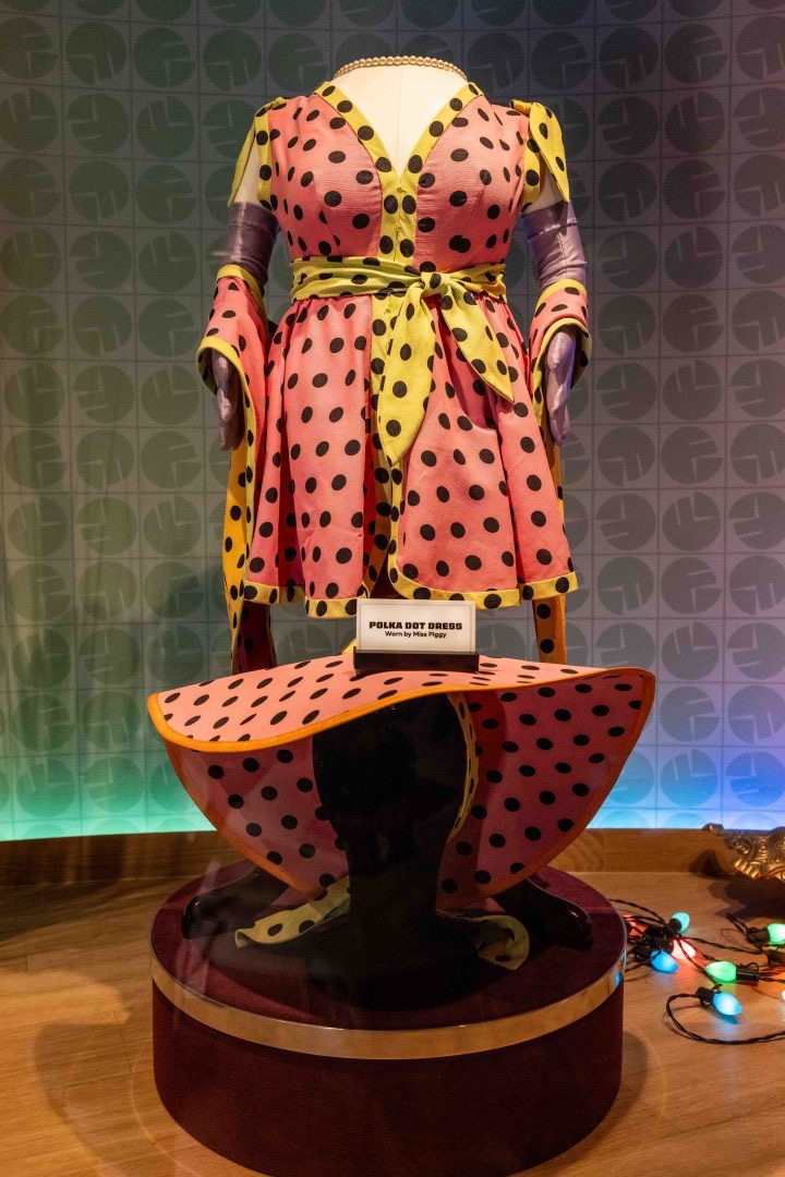 polka dot dress and hat costume from miss piggy muppet in a display case