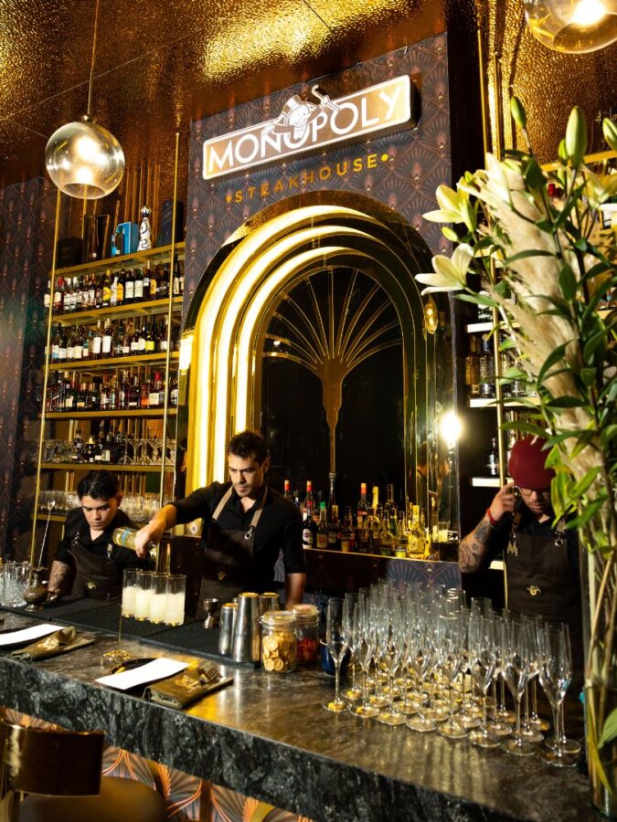 Monopoly Steakhouse bar with gold and art deco adornments