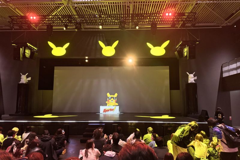 Pika Pika Sparks show with Pikachu DJ character on stage PokéPark Kanto 