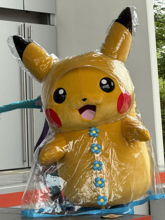 Pikachu character during rain version of Pikachu and Eevee Bubble Carnival at PokéPark Kanto