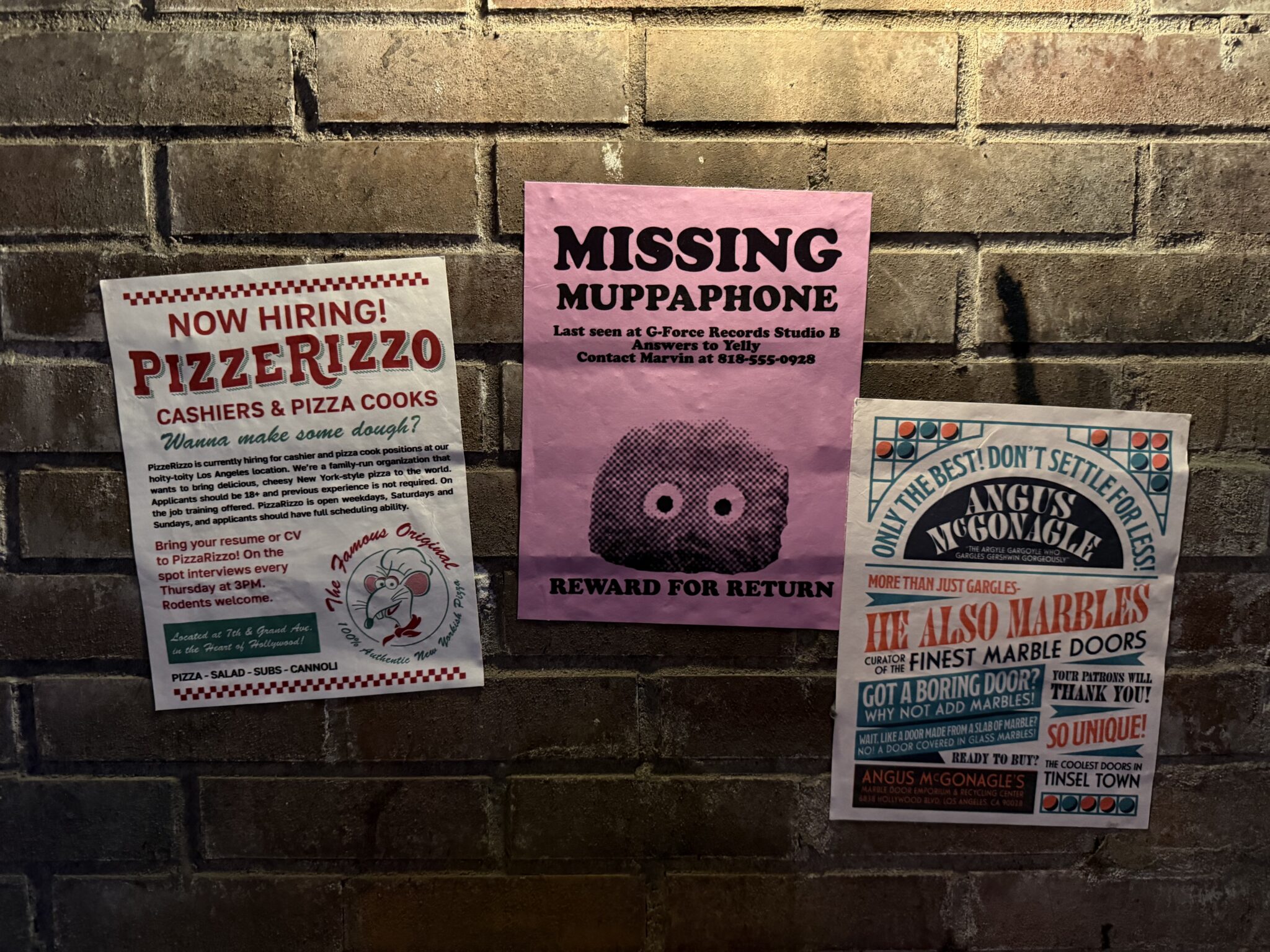Flyers for PizzeRiozzo and marbles doors in muppets coaster queue