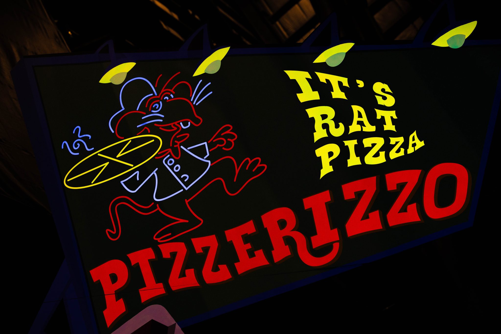 a Pizzerizzo sign on the muppets coaster