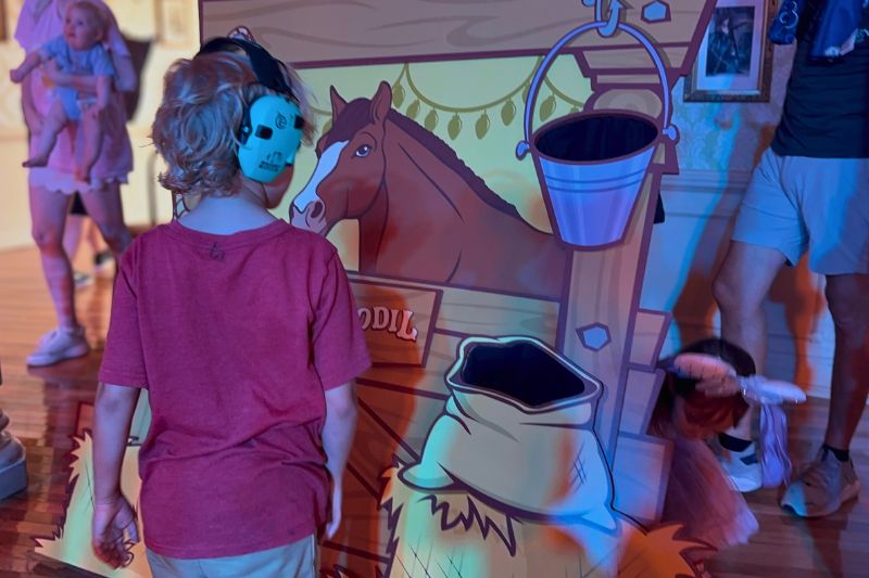Young boy enjoying game Daffodil during Jessie's Roundup Disney Cool Kids' Summer - Photo by Dani Meyering comp