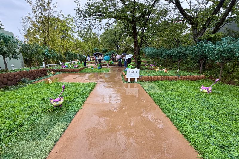entrance to Pokémon Forest at PokéPark Kanto during a rainy day
