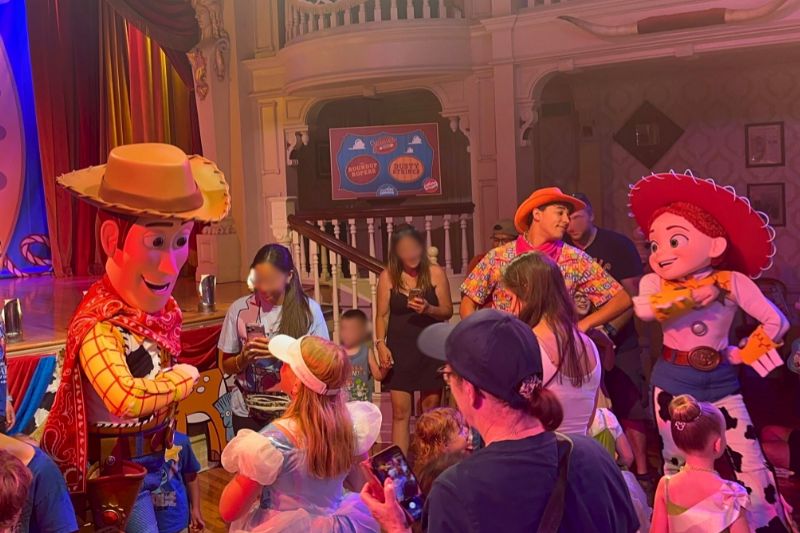 Woody and Jessie characters dance with kids at Jessie's Roundup Magic Kingdom - Photo by Dani Meyering