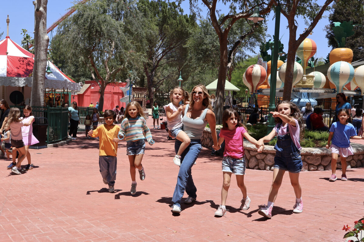 A Family wanders through Looney Tunes Land at Six Flags Magic Mountain