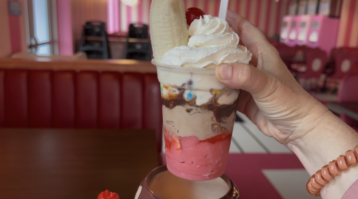 ayers of vanilla, chocolate and strawberry soft serve topped with chocolate sauce, strawberry sauce, whipped cream, a banana, cherry, M&M's, brownie pieces and even chunks of Pop-Tart.