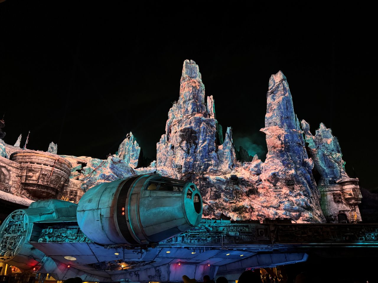 Star Wars: Galaxy's Edge Millennium Falcon at night in Black Spire Outpost