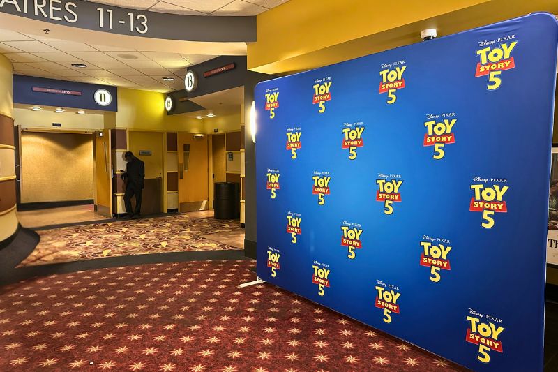 step and repeat background Toy Story 5 movie screening