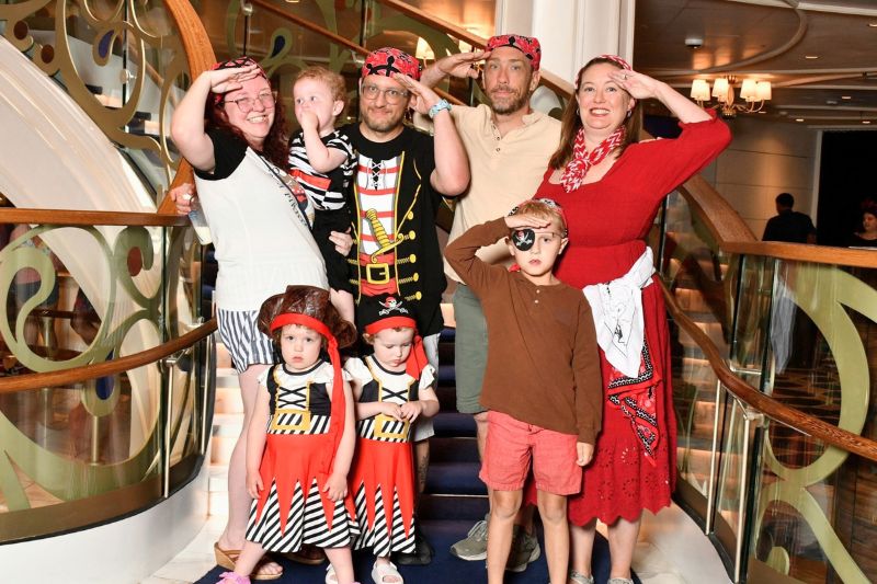 Family together for Pirate Night on Disney Wish
