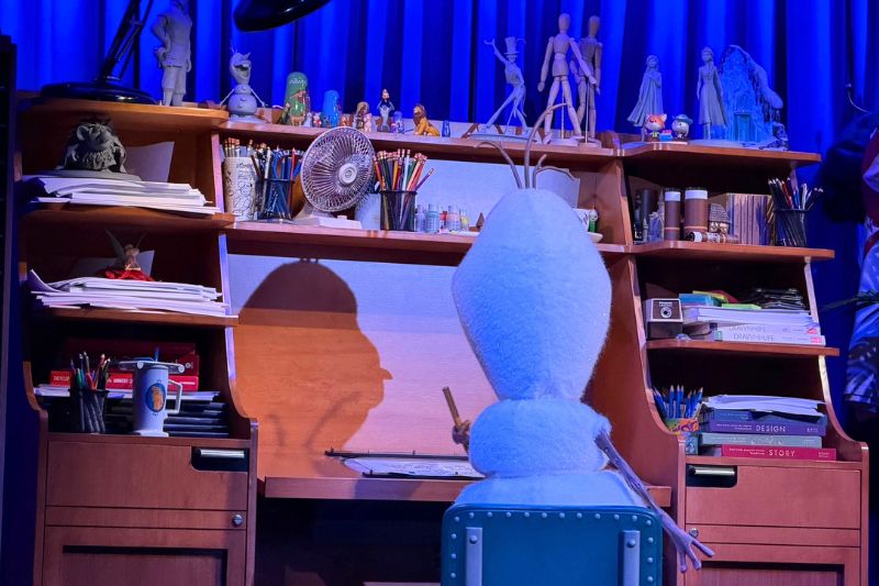 Olaf Draws! animatronic facing away from camera