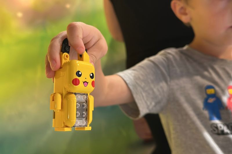 Kid with Pokemon Pikachu smart play at Legoland Florida