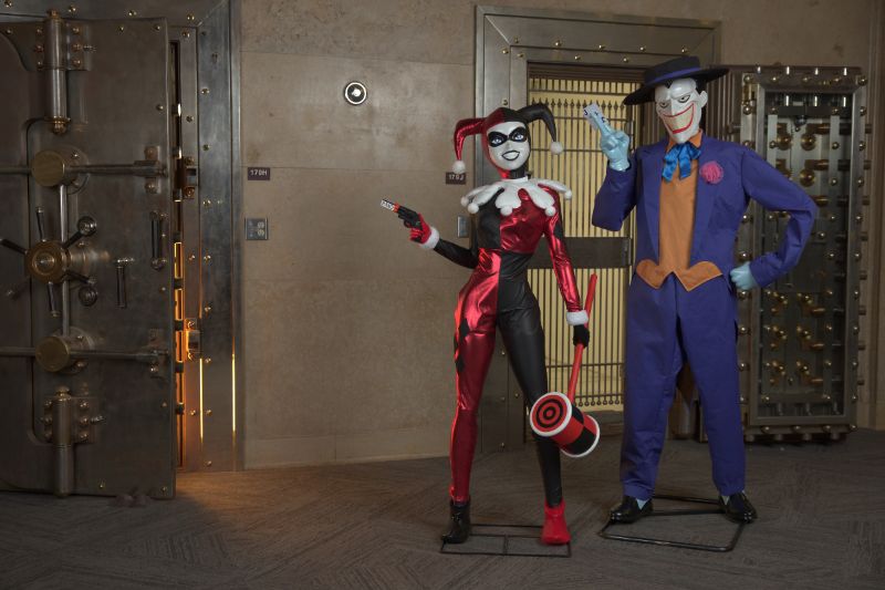 Life sized figures of Joker and Harley Quinn in comic style