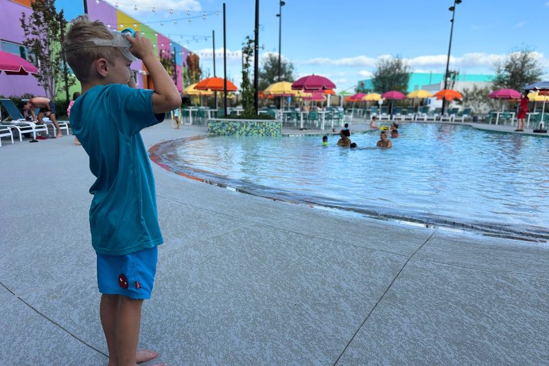 Boy ready to go swimming in pool at Universal Kids Resort Hotel