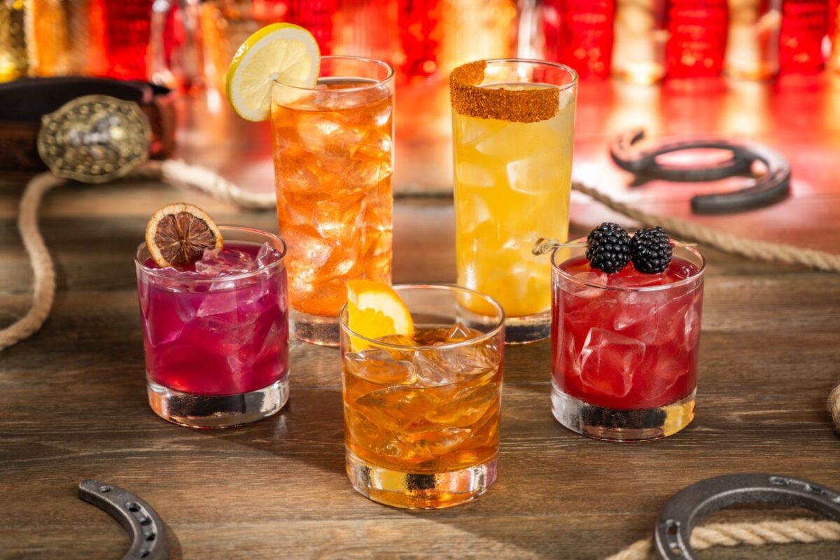 promotional image of cocktails with ice and western background