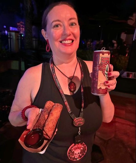 Dani Meyering poses with Southern Egg Rolls and Maniac Mix.
