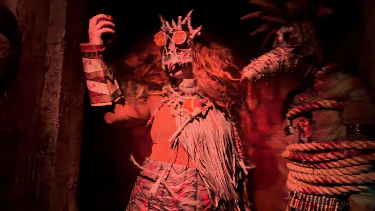 Madlands Cage Cannibals performer inside Halloween Horror Nights house